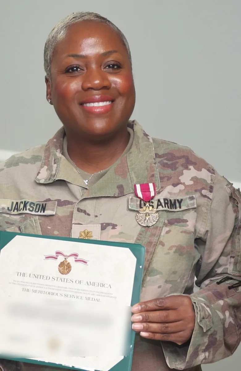 Jackie Jackson with her Meritorious Service Medal Jackie Jackson with her Meritorious Service Medal